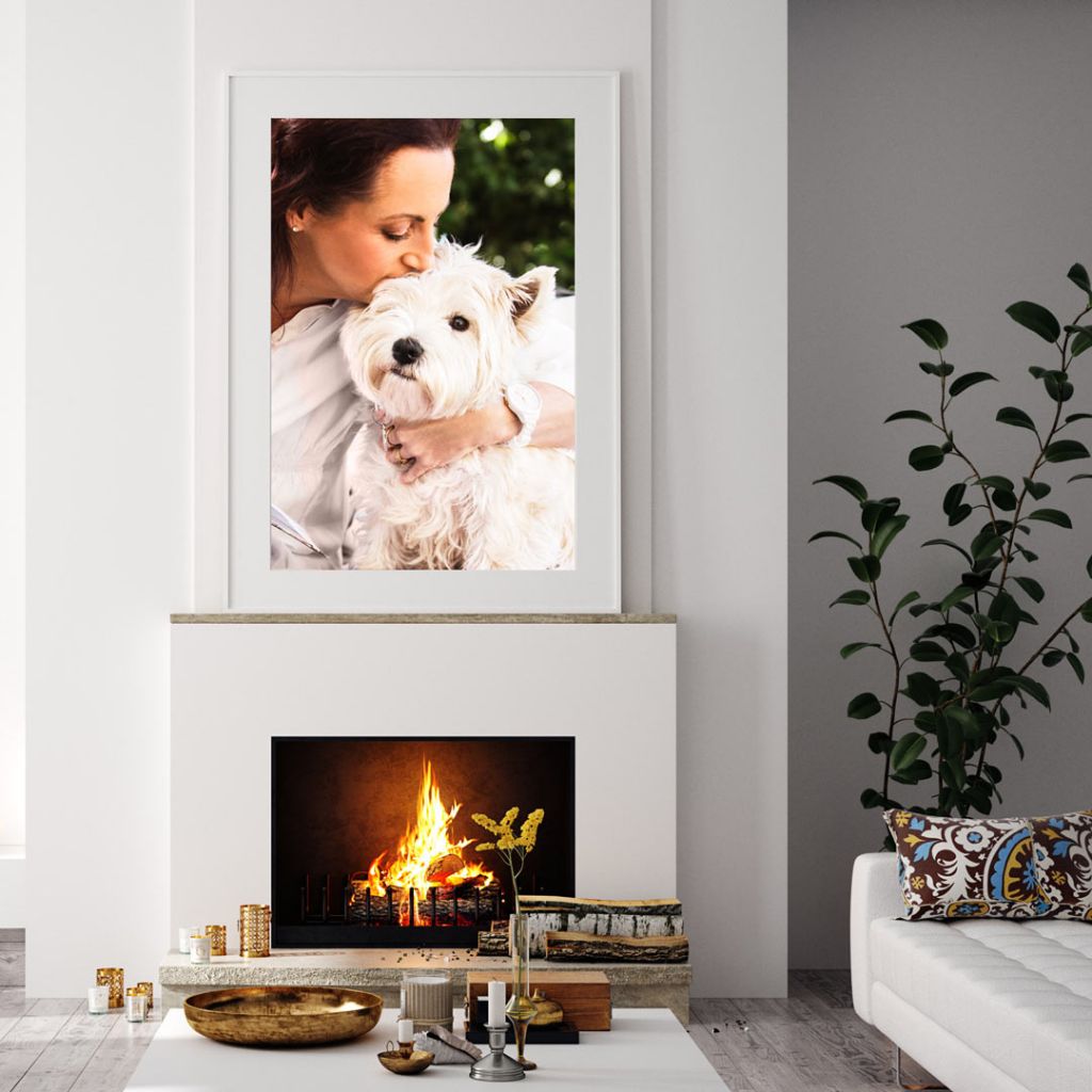 Framed fine art portrait above a fireplace